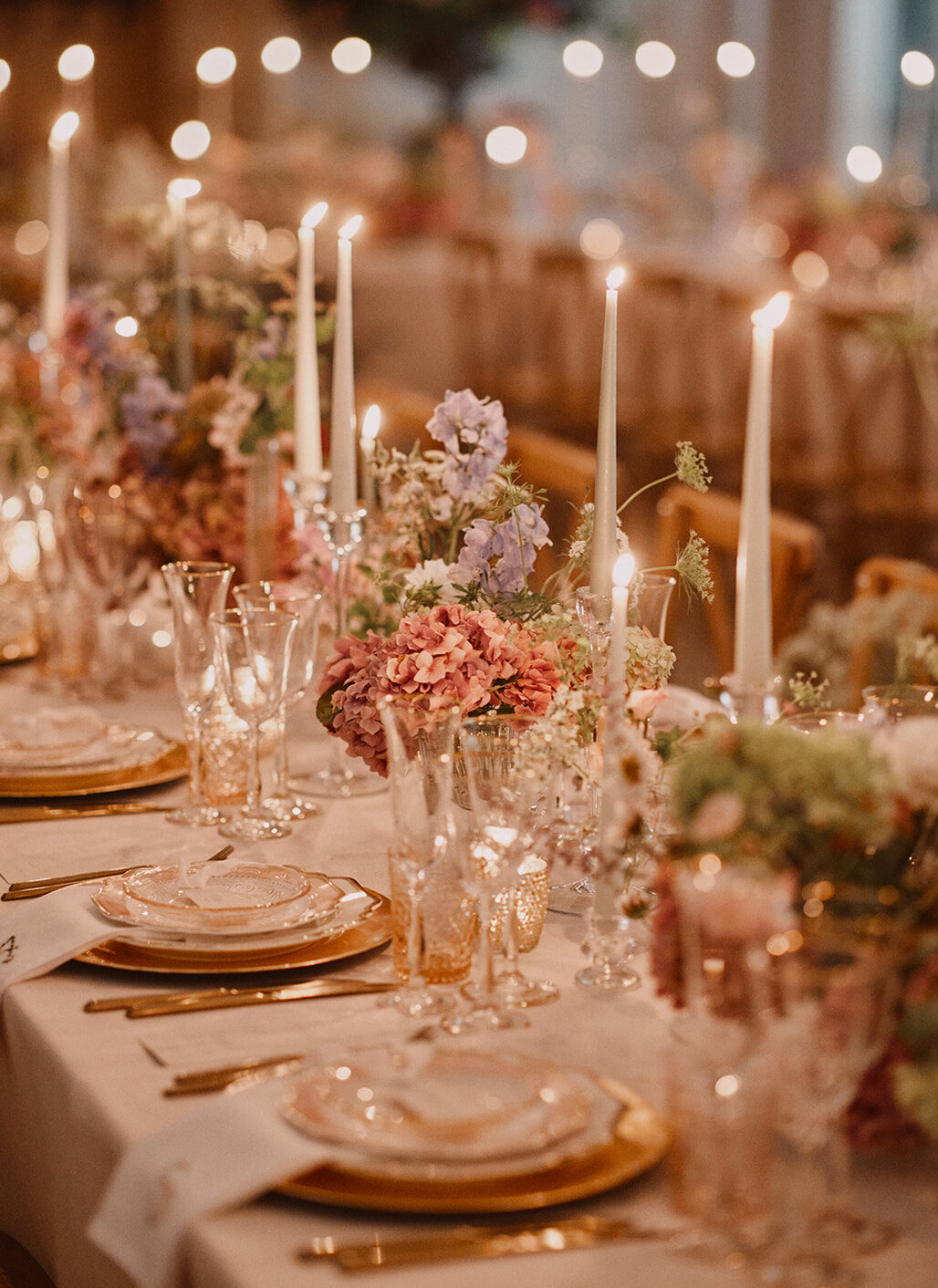 Wedding planner Ella Hartig shows a wedding dinner at Wilderness reserve with lots of flowers and candles