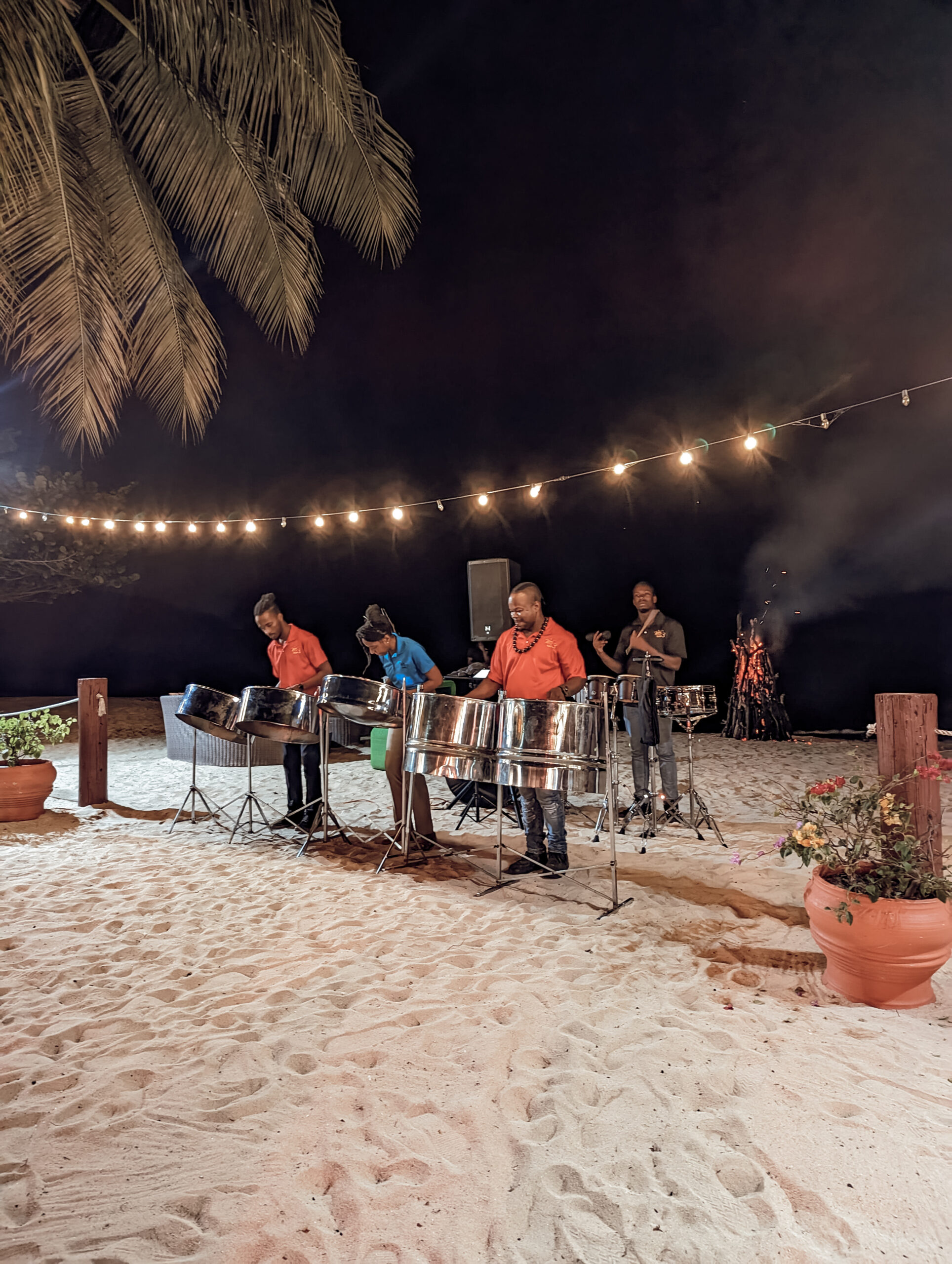 Steel drum band plays on the beach at a Caribbean event