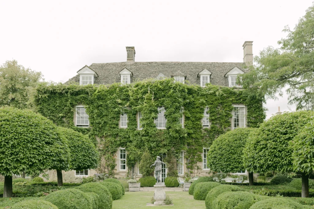 Cornwell Manor's facade, covered in ivy - one of the best UK weekend wedding venues