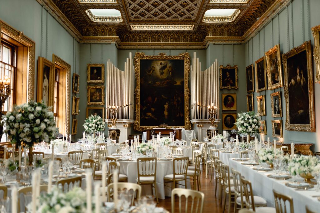 This Somerley House wedding saw the ballroom styled with gold accents to match the picture frames on the wall