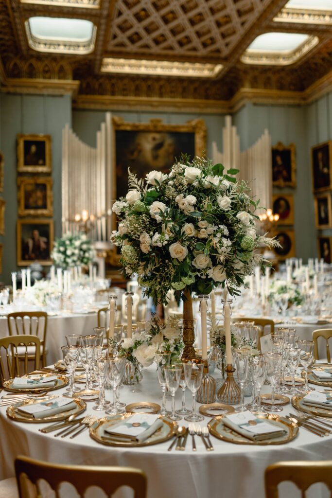 Tall floral table centrepieces at a Somerley House wedding in the ballroom