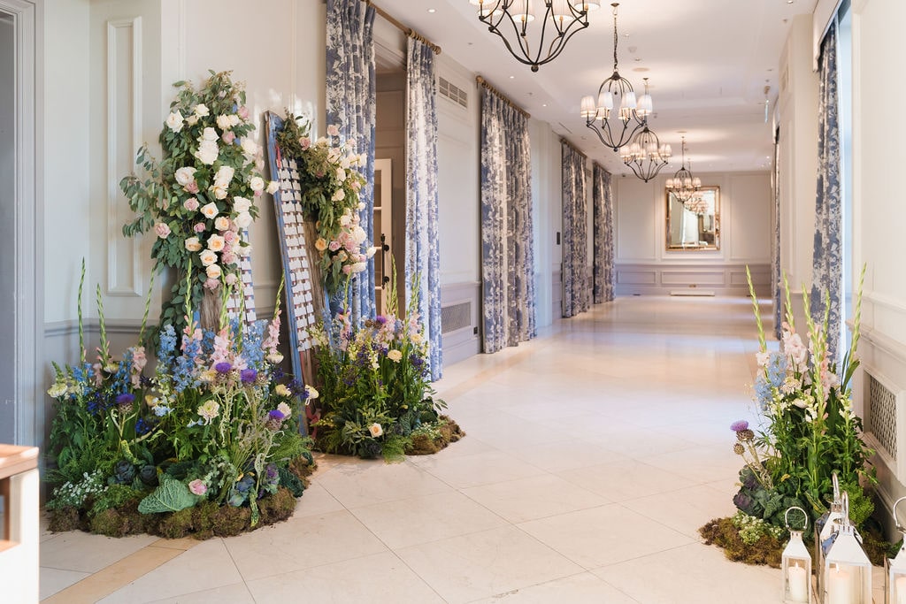 an escort card set up for a summer pastel wedding