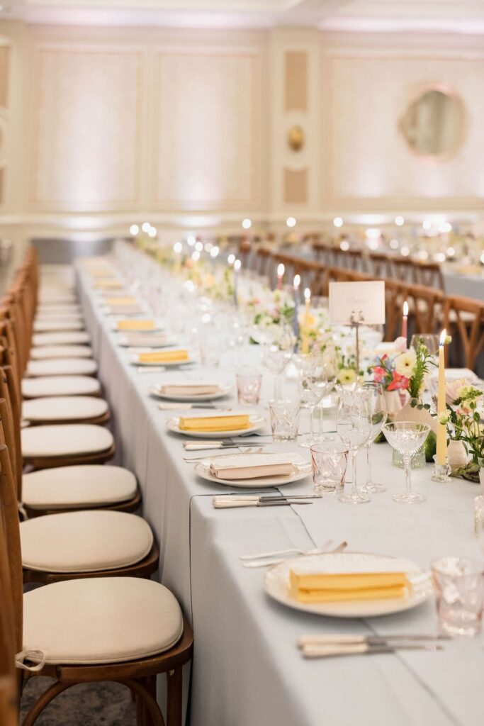 summer pastel wedding table scape with yellow napkins and duck egg blue tablecloth