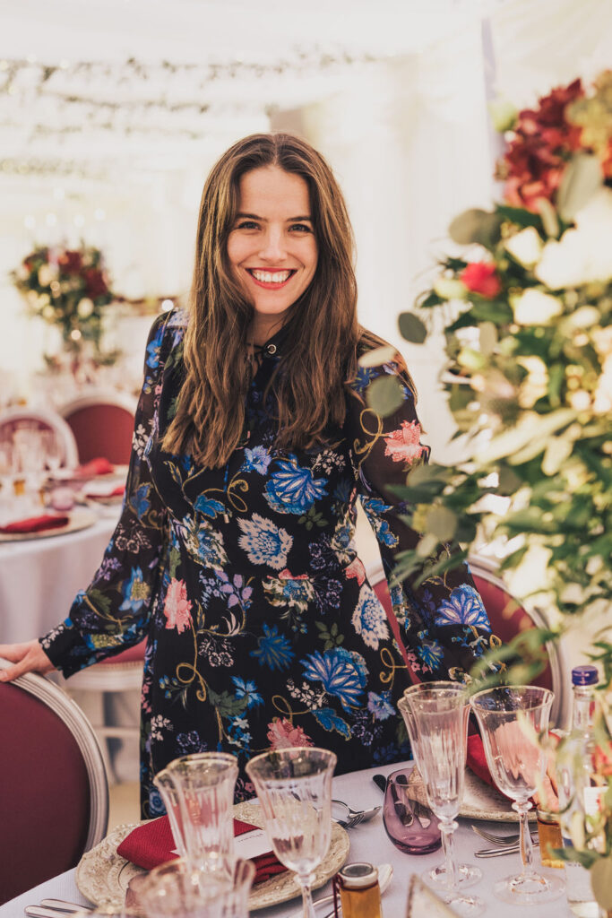 Ella Hartig, luxury wedding planner and short-lead-time celebration expert smiles at the camera