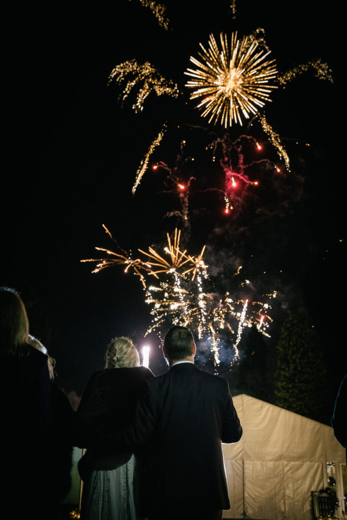 Fireworks display at a short notice winter marquee wedding planned at couple's home by Ella Hartig