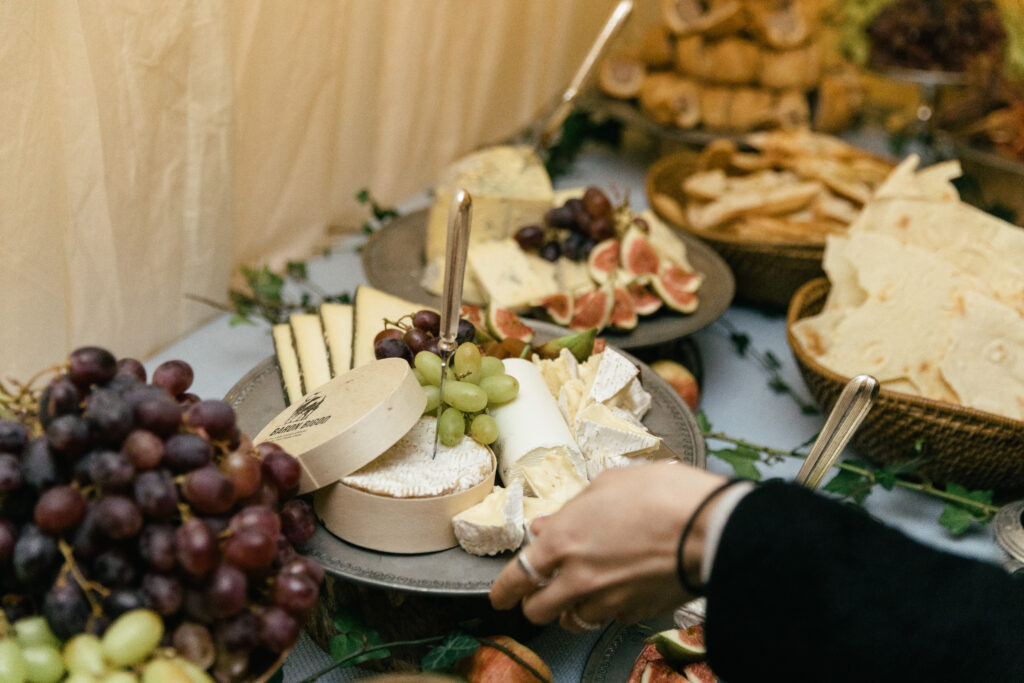 Cheese buffet at a short notice winter marquee wedding planned at couple's home by Ella Hartig