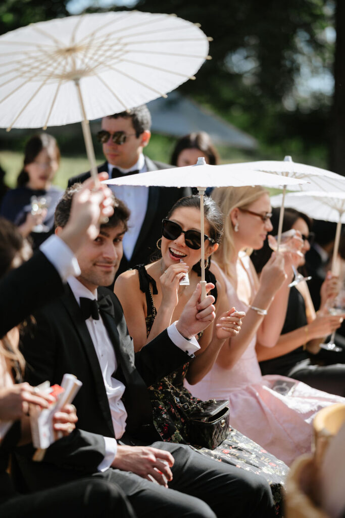 wedding sun umbrellas being used in a wedding ceremony