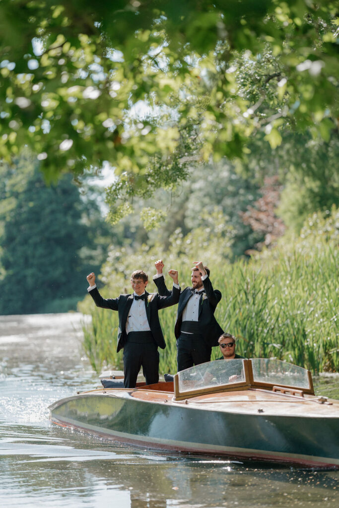 groom arrives by boat for wedding at Avington