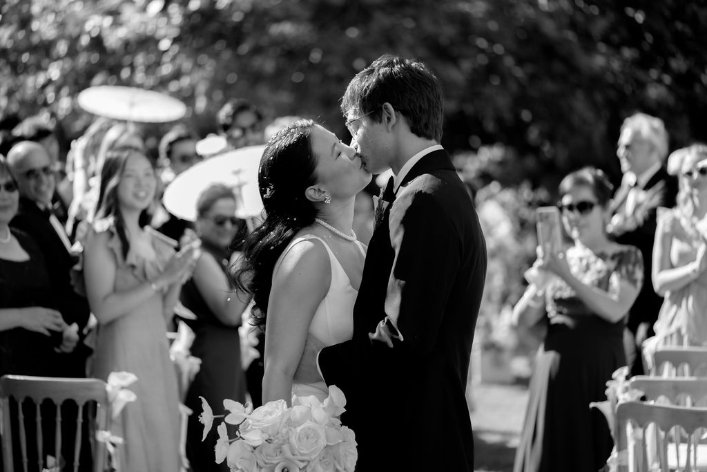 bride and groom kiss